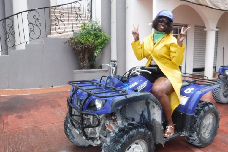 woman in rain coat on ATV